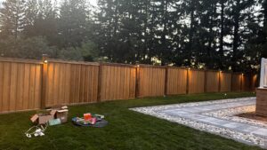 Fence post lighting at dusk by AMM Electric