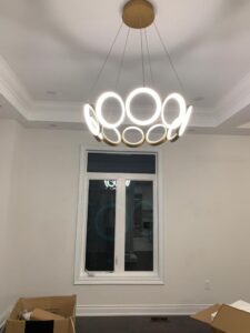 Modern ring chandelier installed by AMM Electric